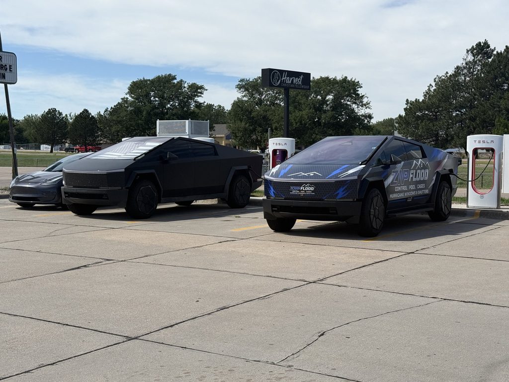 Zip Flood Control Cybertruck at a Tesla Supercharger station